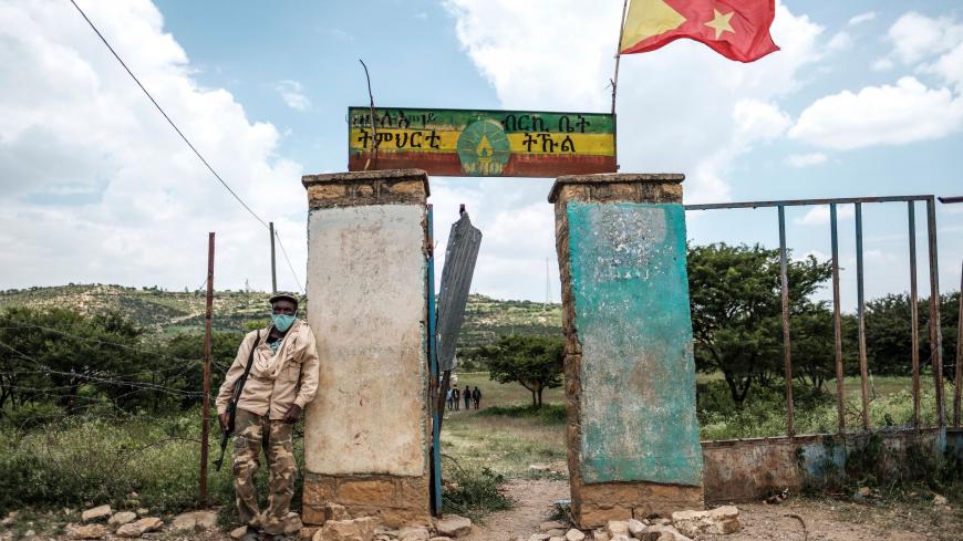 TOPSHOT - An armed member of the community security stands in front of a school where a polling station is located during Tigrays regional elections, in the town of Tikul, 15 kms east from Mekele, Ethiopia, on September 9, 2020. - Ethiopia's northern Tigray region vote on September 9, 2020 in parliamentary elections that Prime Minister Abiy Ahmed's government has deemed illegal.
Polls opened at 6am (0300 GMT) across the mountainous northern Tigray region despite a federal decision to postpone all elections 