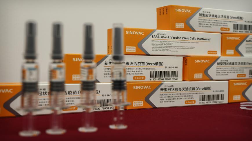 BEIJING, CHINA - SEPTEMBER 24: Syringes and boxes  of the potential COVID-19 vaccine CoronaVac are seen on a table at  Sinovac Biotech where the company is producing their potential COVID-19 vaccine CoronaVac during a media tour on September 24, 2020 in Beijing, China. Sinovacs inactivated vaccine candidate, called CoronaVac, is among a number of companies in the global race to control the coronavirus pandemic.  The company is running Phase 3 human trials in four countries and ramping up production to 300 m