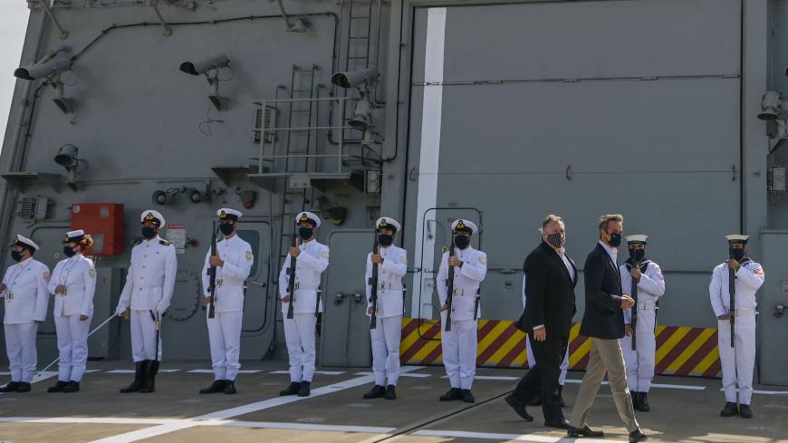 US Secretary of State Mike Pompeo (C-L) and Greek Prime Minister Kyriakos Mitsotakis visit the Greek Naval frigate Salamis during their visit to the Naval Support Activity base at Souda, the foremost US naval facility in the eastern Mediterranean on the Greek island of Crete. - US Secretary of State Mike Pompeo on September 29, 2020, concludes a two-day visit to Greece on with a tour of a strategically vital NATO base on a trip aimed at easing tensions between Greece and Turkey in the eastern Mediterranean.