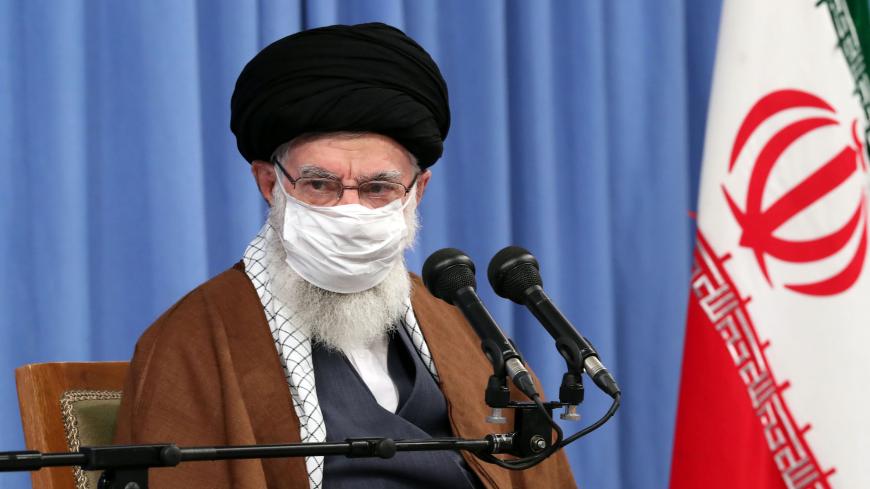 A handout picture provided by the office of Iran's Supreme Leader Ayatollah Ali Khamenei on October 24, 2020, shows him wearing a protective face mask as he gives a speech in the capital Tehran during a meeting of the national staff to discuss the issue of the novel coronavirus pandemic crisis. (Photo by - / KHAMENEI.IR / AFP) / XGTY / === RESTRICTED TO EDITORIAL USE - MANDATORY CREDIT "AFP PHOTO / HO / KHAMENEI.IR" - NO MARKETING NO ADVERTISING CAMPAIGNS - DISTRIBUTED AS A SERVICE TO CLIENTS === (Photo by 