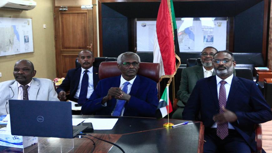 Sudan's Minister of Irrigation and Water Resources Yasser Abbas (C) participates in a videoconference with his Egyptian and Ethiopian counterparts (unseen) in the Sudanese capital Khartoum on November 1, 2020. - Khartoum said it is to organise a week of negotiations on Ethiopia's controversial dam on the Nile that has riled downstream neighbours Egypt and Sudan, following a three-way videoconference. (Photo by Ebrahim HAMID / AFP) (Photo by EBRAHIM HAMID/AFP via Getty Images)