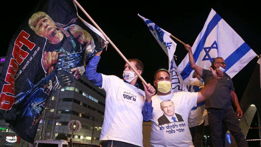 Israeli Right wing Likud party affiliates and supporters od US President Donald Trump attend a pre-election rally in the Israeli city of Beit Shemesh on Novemver 2, 2020, ahead of the US presidential election. (Photo by Menahem KAHANA / AFP) (Photo by MENAHEM KAHANA/AFP via Getty Images)