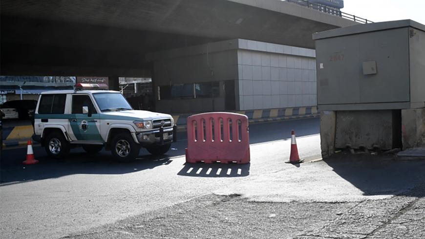 Saudi police close a street leading to a non-Muslim cemetery in the Saudi city of Jeddah where a bomb struck a World War I commemoration attended by European diplomats on November 11, 2020 leaving several people wounded amid Muslim anger over French cartoons. - The attack is the second assault in the kingdom in less than a month, as French President Emmanuel Macron has sought to assuage anger across Muslim nations over satirical cartoons of the Prophet Mohammed. (Photo by - / AFP) (Photo by -/AFP via Getty 