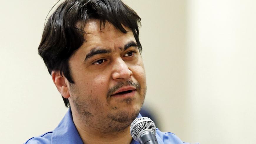 Ruhollah Zam, a former opposition figure who had lived in exile in France and had been implicated in anti-government protests, speaks during his trial at Iran's Revolutionary Court in Tehran on June 2, 2020. - Iran said it has sentenced to death Ruhollah Zam. The court has considered 13 counts of charges together as instances of 'corruption on earth' and therefore passed the death sentence, judiciary spokesman Gholamhossein Esmaili said. (Photo by ALI SHIRBAND / MIZAN NEWS / AFP) (Photo by ALI SHIRBAND/MIZA