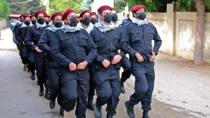 Members of Lebanon's Shiite movement Hezbollah take part in a Martyr's Day parade in the eastern Lebanese city of Baalbek on November 11, 2020. (Photo by - / AFP) (Photo by -/AFP via Getty Images)