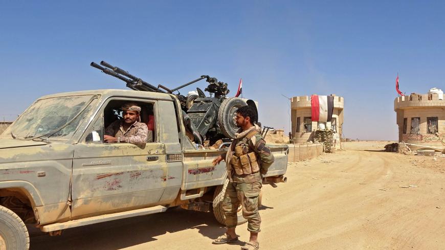 A fighter sits in a "technical" (pickup truck mounted with turret) as forces loyal to Yemen's Saudi-backed government clash with Huthi rebel fighters around the strategic government-held "Mas Camp" military base, in al-Jadaan area about 50 kilometres northwest of Marib in central Yemen, on November 22, 2020. - Marib has been the scene of intense fighting in recent months as the Huthis try to seize control of the oil-rich province -- the government's last northern stronghold. (Photo by - / AFP) (Photo by -/A