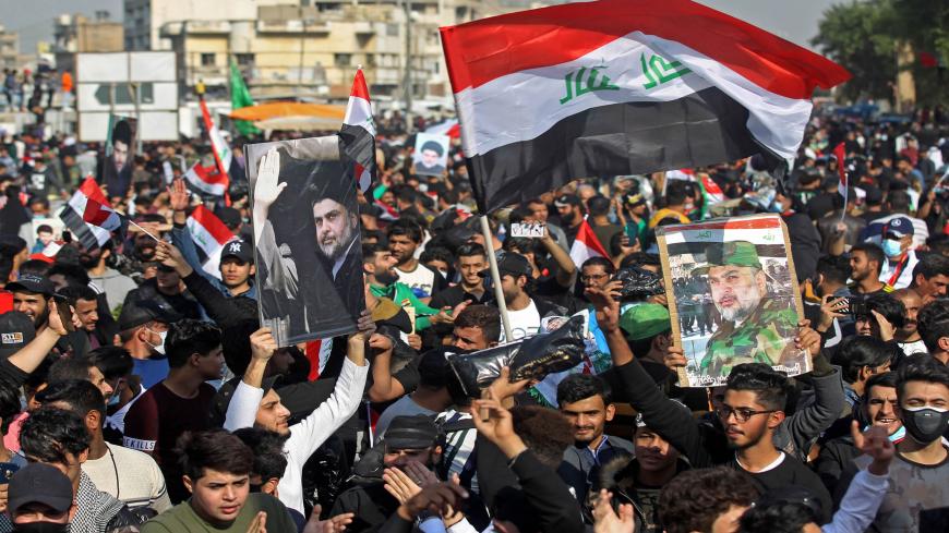 Supporters of Iraq's Shiite cleric Moqtada al-Sadr demonstrate in Tahrir Square in Baghdad on November 27, 2020. - Tens of thousands of supporters of the Shiite cleric Moqtada al-Sadr gathered in the Iraqi capital in a show of political power, as the legislative elections are scheduled for next June. (Photo by Ahmad AL-RUBAYE / AFP) (Photo by AHMAD AL-RUBAYE/AFP via Getty Images)