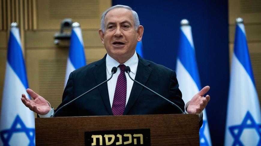 Israeli Prime Minister Benjamin Netanyahu delivers a statement to his Likud party MKs (members of Knesset), at the Likud centre in the Knesset in Jerusalem on December 2, 2020. - Israel's precarious coalition government took a first step towards collapse on December 2, as lawmakers gave preliminary approval to a bill dissolving parliament, raising the risk of a fourth election inside two years. (Photo by Yonathan SINDEL / POOL / AFP) (Photo by YONATHAN SINDEL/POOL/AFP via Getty Images)