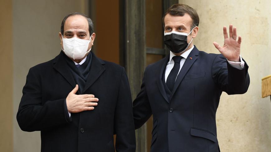 French President Emmanuel Macron (R) welcomes his Egyptian counterpart Abdel Fattah al-Sisi at the Elysee presidential Palace on December 7, 2020 in Paris, for a meeting as part of al-Sisi's a three-day controversial state visit to France, with activists warning Paris not to turn a blind eye to Cairo's rights record with a red carpet welcome. (Photo by Bertrand GUAY / AFP) (Photo by BERTRAND GUAY/AFP via Getty Images)
