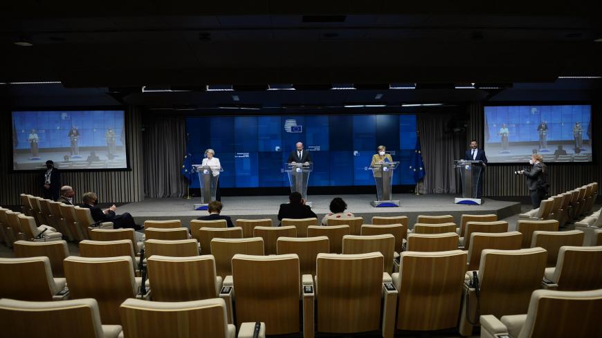 European Commission President Ursula von der Leyen (L), European Council President Charles Michel (C) and Germany's Chancellor Angela Merkel (R) give a press conference at the end of an EU summit at the European Council building in Brussels, on December 11, 2020. (Photo by JOHANNA GERON / various sources / AFP) (Photo by JOHANNA GERON/AFP via Getty Images)