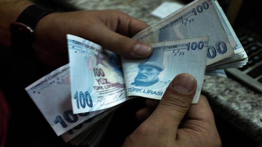 ISTANBUL, TURKEY - JULY 29: Detail as a man counts Turkish Lira at a currency exchange office on July 29, 2020 in Istanbul, Turkey. The Turkish Lira remains under pressure after briefly trading at a record low against the euro of 8.17 on Tuesday amid  investor concerns around Turkey's foreign denomination debt and potential  EU sanctions.  (Photo by Chris McGrath/Getty Images)