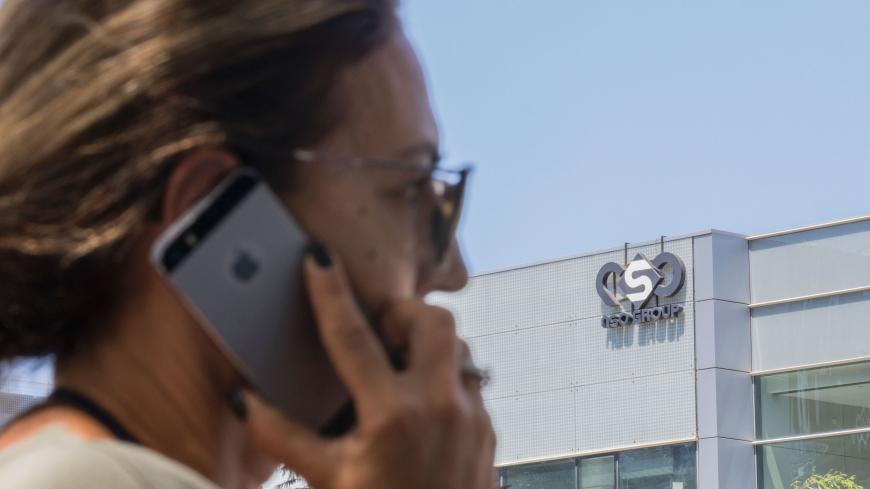 An Israeli woman uses her iPhone in front of the building housing the Israeli NSO group, on August 28, 2016, in Herzliya, near Tel Aviv.
Apple iPhone owners, earlier in the week, were urged to install a quickly released security update after a sophisticated attack on an Emirati dissident exposed vulnerabilities targeted by cyber arms dealers.
Lookout and Citizen Lab worked with Apple on an iOS patch to defend against what was called "Trident" because of its triad of attack methods, the researchers said in a