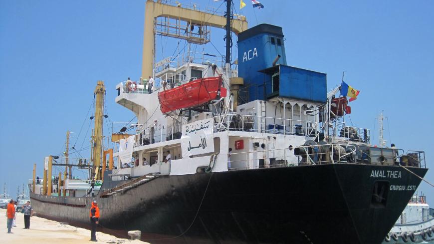 A Libyan ship carrying aid for Palestinians in the Gaza Strip docks at the Egyptian port of el-Arish on July 15, 2010 after agreeing to deliver its cargo of aid through Egyptian territory. AFP PHOTO/STR (Photo credit should read -/AFP via Getty Images)