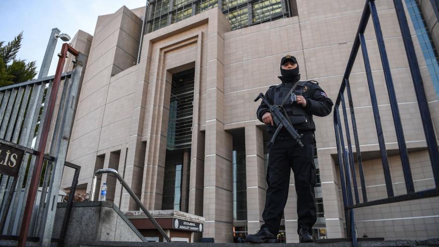 A Turkish policeman stands guard outside the courthouse in Istanbul on March 28, 2019, during the trial of Metin Topuz, an US consulate staffer accused of spying and attempting to overthrow the government. - Topuz, a Turkish citizen and liaison with the US Drug Enforcement Administration, was arrested in 2017 and has been accused of ties to US-based preacher Fethullah Gulen who Ankara says ordered a failed 2016 coup. (Photo by OZAN KOSE / AFP) (Photo credit should read OZAN KOSE/AFP via Getty Images)