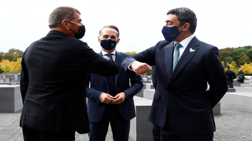 BERLIN, GERMANY - OCTOBER 6: UAE Foreign Minister Sheikh Abdullah bin Zayed al-Nahyan and his Israeli counterpart Gabi Ashkenazi greet as they visit the Holocaust memorial together with German Foreign Minister Heiko Maas prior to their historic meeting on October 6, 2020 in Berlin, Germany. The foreign ministers of Israel and the United Arab Emirates visited the Holocaust Memorial during their first meeting since their countries signed a US-brokered deal to normalize relations.  (Photo by Michele Tantussi-P