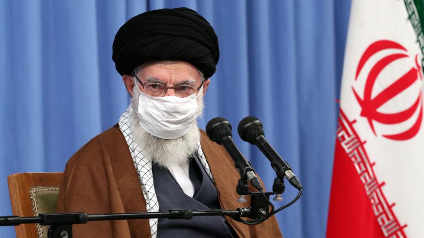 A handout picture provided by the office of Iran's Supreme Leader Ayatollah Ali Khamenei on October 24, 2020, shows him wearing a protective face mask as he gives a speech in the capital Tehran during a meeting of the national staff to discuss the issue of the novel coronavirus pandemic crisis. (Photo by - / KHAMENEI.IR / AFP) / XGTY / === RESTRICTED TO EDITORIAL USE - MANDATORY CREDIT "AFP PHOTO / HO / KHAMENEI.IR" - NO MARKETING NO ADVERTISING CAMPAIGNS - DISTRIBUTED AS A SERVICE TO CLIENTS === (Photo by 