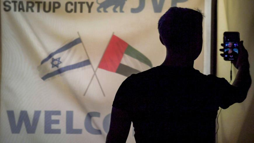 A member of an Israeli tech delegation uses his phone in a video call during an evening meeting with Emirati counterparts at a hotel in Dubai on October 25, 2020. - Israel and the United Arab Emirates agreed on October 19 to visa-free travel, an unprecedented arrangement between Israel and an Arab state, signed after the first ever official UAE delegation landed in Tel Aviv. (Photo by Karim SAHIB / AFP) (Photo by KARIM SAHIB/AFP via Getty Images)