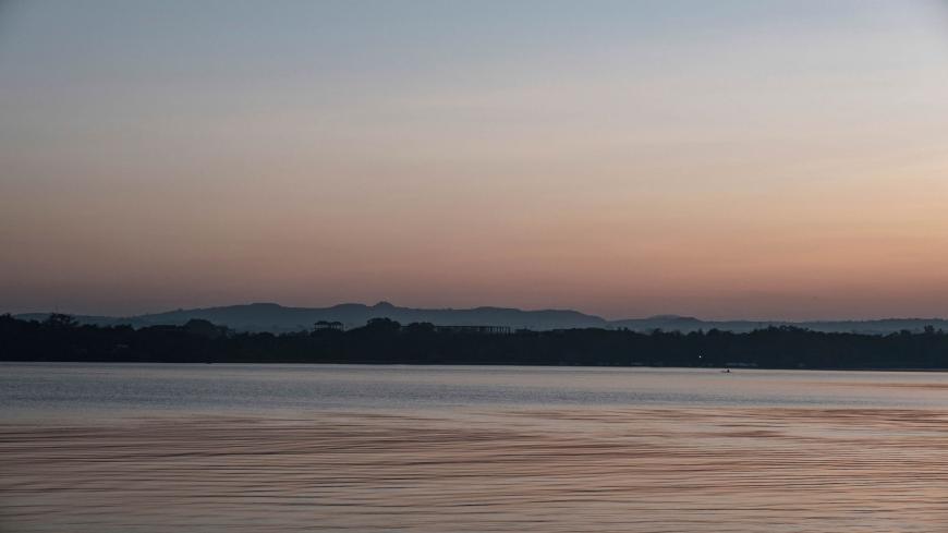 A fisherman is pictured in his boat on lake Tana, in the city of Bahir Dar, Ethiopia, on November 11, 2020. - Lake Tana, a UNESCO biosphere reserve, is the origin of the blue Nile river that feeds the Grand Ethiopian Renaissance Dam (GERD). (Photo by EDUARDO SOTERAS / AFP) (Photo by EDUARDO SOTERAS/AFP via Getty Images)