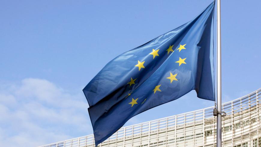 In this picture taken on December 25, 2020 a flag of the European Union can be seen fluttering outside the European commission headquarters in Brussels. (Photo by François WALSCHAERTS / AFP) (Photo by FRANCOIS WALSCHAERTS/AFP via Getty Images)