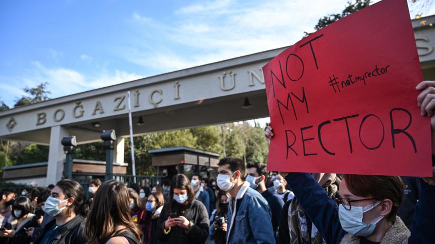 Students chant slogans and hold placards on January 4, 2021 in front of the Bogazici University in Istanbul during a protest against the direct appointment of the new rector to Bogazici university by Turkish President Recep Tayyip Erdogan. (Photo by Ozan KOSE / AFP) (Photo by OZAN KOSE/AFP via Getty Images)