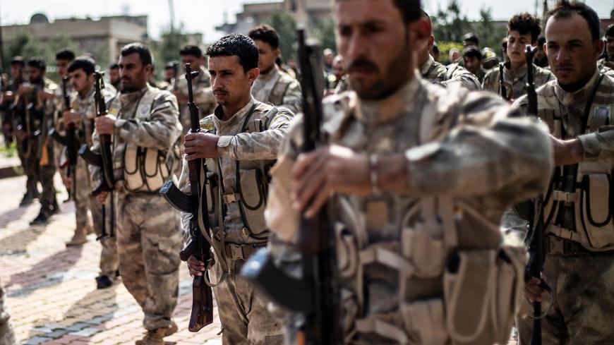 Members of the Kurdish-led Syrian Democratic Forces (SDF) attend the funeral of an Arab fighter in SDF who was killed the previous week in the eastern Deir Ezzor province, in northeastern Syrian Kurdish-majority city of Qamishli on April 10, 2019. (Photo by Delil SOULEIMAN / AFP)        (Photo credit should read DELIL SOULEIMAN/AFP via Getty Images)