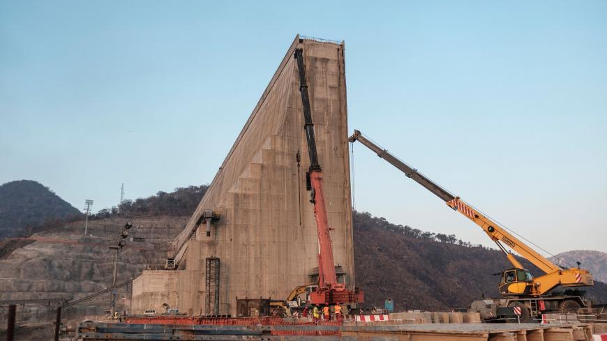 (FILES) This file photo taken on December 26, 2019 shows a general view of the construction works at the Grand Ethiopian Renaissance Dam (GERD), near Guba in Ethiopia. - The Nile, Egypt's lifeline since Pharaonic days, faces massive strain from pollution, over-use and climate change -- and now the threat of a colossal dam being built far upstream in Ethiopia. When its London-sized reservoir starts to fill this summer, Egypt fears the mega-project will spell an existential threat to its teeming population of