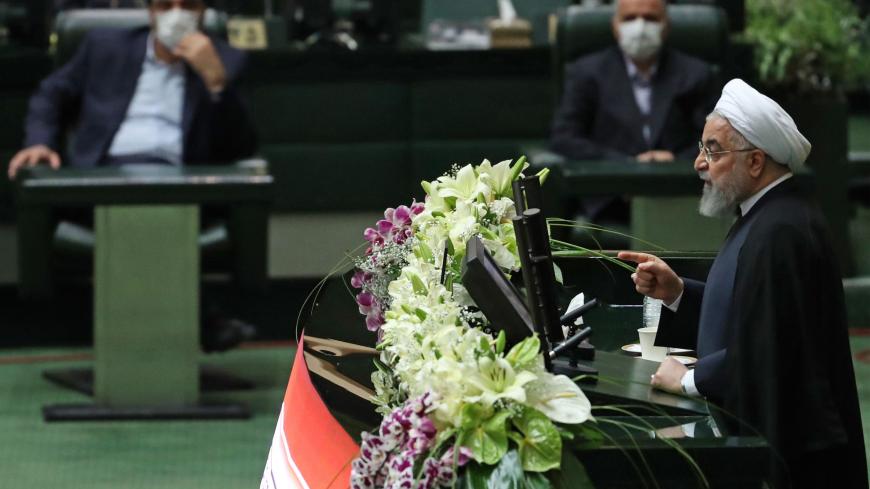 Iranian President Hassan Rouhani delivers a speech during the inaugural session of the new parliament following February elections, in Tehran on May 27, 2020. - The 11th legislature since the Islamic revolution of 1979 opened as the country's economy, which has been hard hit by the novel coronavirus, gradually returns to normal. Rouhani, who is in the final year of his second and final term, called on MPs, collectively and individually, to place the "national interest above special interests", "party intere