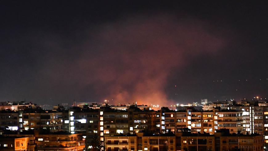 Smoke billows following an Israeli airstrike targeting south of the capital Damascus, on July 20, 2020. - Israeli strikes south of the Syrian capital wounded seven Syrian soldiers, state media reported, in an attack which a war monitor said hit several positions of regime forces and Iran-backed militias. (Photo by STR / AFP) (Photo by STR/AFP via Getty Images)