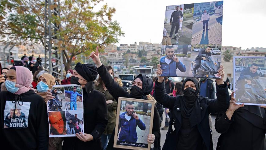 Israeli Arab women take part in a protest after a student was killed in a reported police shootout this week, in the northern Arab-Israeli town of Umm-Al Fahem on February 5, 2021. - Hundreds of Arab Israelis demonstrated protesters defied coronavirus restrictions on gatherings to demonstrate in front of the police station in the Arab-Israeli city of Umm al-Fahm. (Photo by AHMAD GHARABLI / AFP) (Photo by AHMAD GHARABLI/AFP via Getty Images)