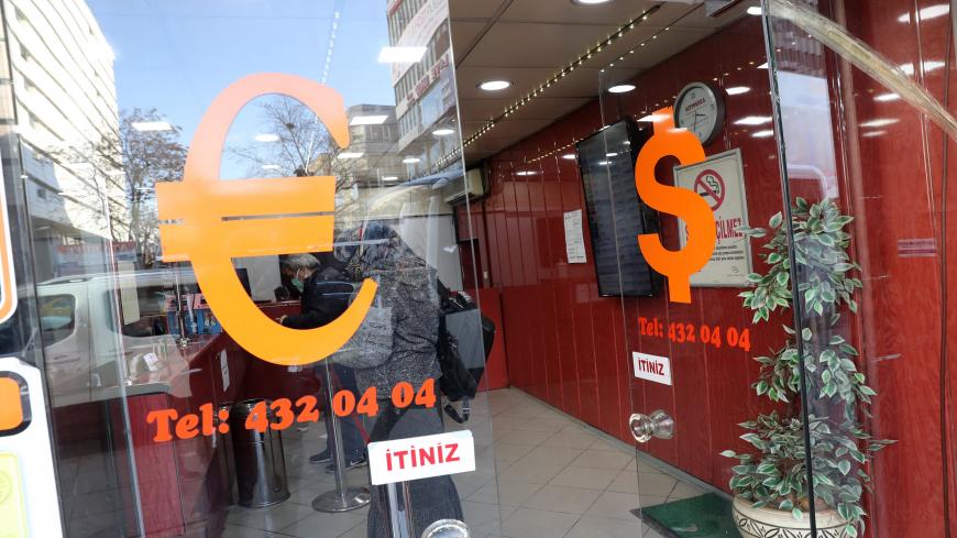 Customers stand by the desk at a currency exchange office, in Ankara, Turkey on February 5, 2021. - Turkey's central bank is to decide interest rate on February 18, 2021. (Photo by Adem ALTAN / AFP) (Photo by ADEM ALTAN/AFP via Getty Images)