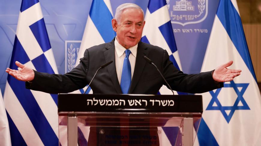 Israeli Prime Minister Benjamin Netanyahu delivers a statement next to the Greek Prime Minister Kyriakos Mitsotakis (unseen) after their meeting in the Prime Minister's office in Jerusalem on February 8, 2021. (Photo by menahem kahana / POOL / AFP) (Photo by MENAHEM KAHANA/POOL/AFP via Getty Images)