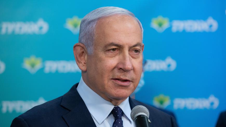 Israeli Prime Minister Netanyahu attends a ceremony marking the 4,000,000th person to be vaccinated at Leumit Health Care Services vaccination facility in Jerusalem on February 16, 2021. - Israel's largest healthcare provider said a study of more than half a million fully vaccinated Israelis indicated the Pfizer/BioNTech jab gave 94 percent protection against Covid-19. (Photo by Alex KOLOMIENSKY / POOL / AFP) (Photo by ALEX KOLOMIENSKY/POOL/AFP via Getty Images)