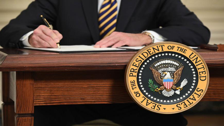 US President Joe Biden signs an executive order on securing critical supply chains, in the State Dining Room of the White House in Washington, DC, February 24, 2021. (Photo by SAUL LOEB / AFP) (Photo by SAUL LOEB/AFP via Getty Images)