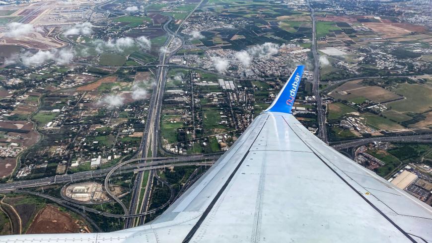 This picture taken on December 16, 2020 shows a view above Israel from the window of a plane aboard a flydubai flight from Ben Gurion International Airport to Dubai upon departure. - The first flydubai aircraft landed in Dubai from Tel Aviv on November 26, inaugurating commercial flights between the two cities following the normalisation of ties between the UAE and Israel. The United Arab Emirates in September signed a landmark US-brokered deal to formalise relations with Israel, the first such agreement by