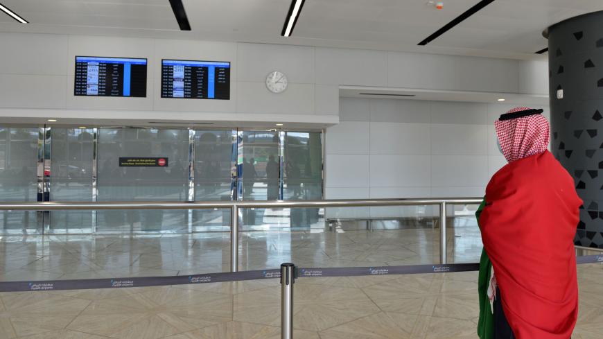 A Saudi man waits for the arrival of relatives at King Khalid International Airport in the Saudi capital Riyadh on the first commercial flight from Qatar, on January 11, 2021. - Following a Gulf diplomatic thaw, air travel between Qatar and Saudi Arabia has been resumed according to the countries' airlines, a major landmark as Doha's former Gulf rivals normalise ties under a landmark agreement. (Photo by FAYEZ NURELDINE / AFP) (Photo by FAYEZ NURELDINE/AFP via Getty Images)