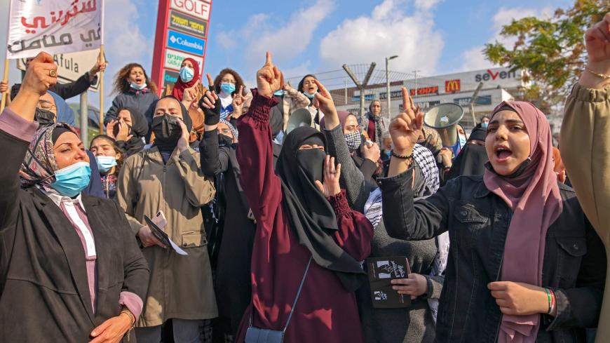 Israeli Arab women take part in a protest after a student was killed in a reported police shootout this week, in the northern Arab-Israeli town of Umm-Al Fahem  on February 5, 2021. - Hundreds of Arab Israelis demonstrated protesters defied coronavirus restrictions on gatherings to demonstrate in front of the police station in the Arab-Israeli city of Umm al-Fahm. (Photo by AHMAD GHARABLI / AFP) (Photo by AHMAD GHARABLI/AFP via Getty Images)