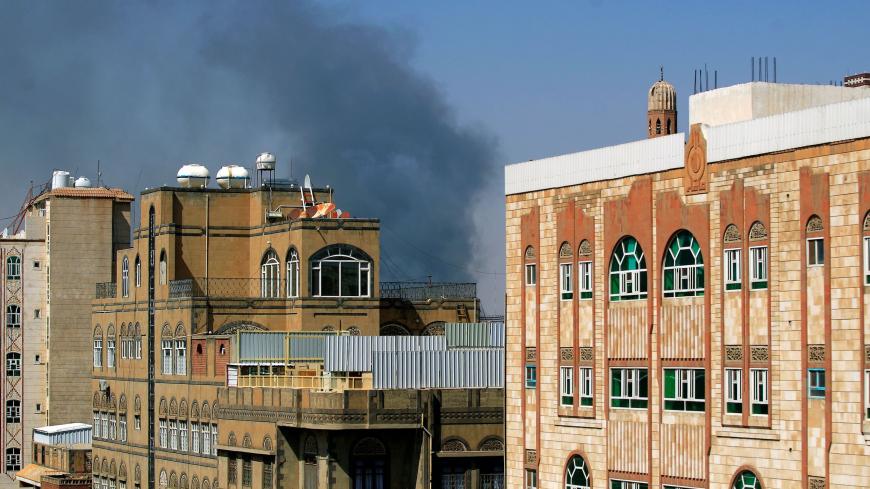 Smoke billows following a reported airstrike by the Saudi-led coalition in the Yemeni capital Sanaa, on March 7, 2021. - The Saudi-led military coalition mounted air strikes on Yemen's Huthi-controlled capital after it intercepted 10 drones launched by the Iran-backed rebels, state media reported. "The military operation targets Huthi military capabilities in Sanaa and a number of other provinces", the coalition was quoted as saying by the official Saudi Press Agency. (Photo by MOHAMMED HUWAIS / AFP) (Photo