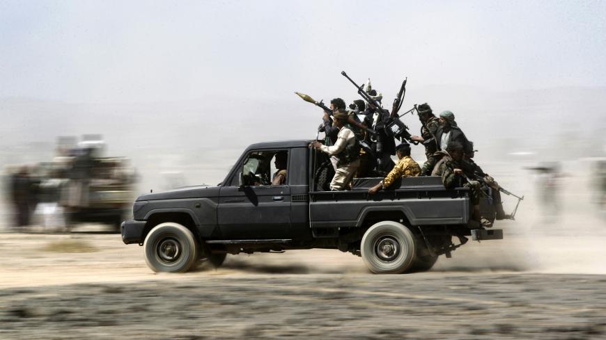 TOPSHOT - Armed Yemeni tribesmen loyal to the Shiite Huthi rebels sit in the back of an armed vehicle during a gathering to mobilise more fighters into several battlefronts on November 1, 2016 on the outskirts of the capital Sanaa.
The war in Yemen escalated in March 2015 when the Saudi-led coalition launched a military campaign to push back the Huthi rebels, after they seized the capital in 2014 and then advanced on other parts of Yemen.
/ AFP / MOHAMMED HUWAIS (Photo credit should read MOHAMMED