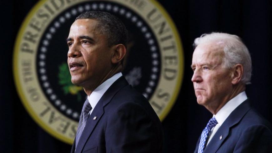 U.S. President Barack Obama (L) unveils a series of proposals to counter gun violence as Vice President Joe Biden looks on during an event at the White House in Washington, January 16, 2013. Vice President Joe Biden delivered his recommendations to Obama after holding a series of meetings with representatives from the weapons and entertainment industries as requested by the president after the December 14 school shooting in Newtown, Connecticut, in which 20 children and six adults were killed. REUTERS/Jaso