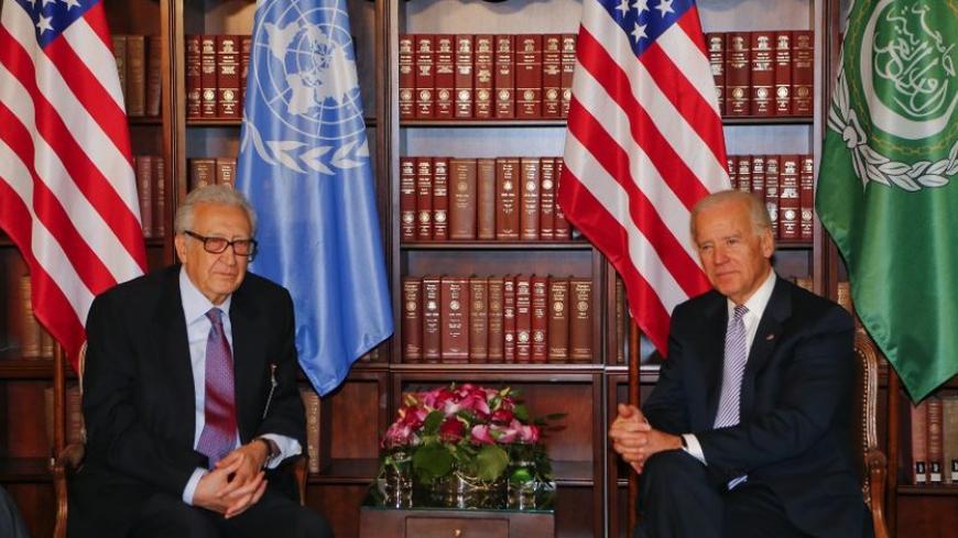 U.N. envoy Lakhdar Brahimi and U.S. Vice-President Joe Biden (R) meet for bilateral talks during the 49th Conference on Security Policy in Munich February 2, 2013. Senior U.S., Russian and U.N. officials, along with the leader of the Syrian opposition, were all expected in Munich on Saturday, providing a rare opportunity for talks to revive efforts to end the civil war in Syria. REUTERS/Michael Dalder(GERMANY - Tags: MILITARY POLITICS) - RTR3D9H3