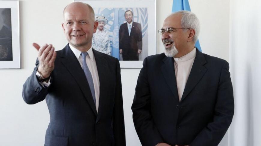 British Foreign Minister William Hague (L). gestures as he meets with Iran's Foreign Minister Mohammad Javad Zarif at the beginning of their bilateral meeting at the United Nations in New York September 23, 2013. REUTERS/Jason DeCrow/Pool (UNITED STATES - Tags: POLITICS) - RTX13X4E