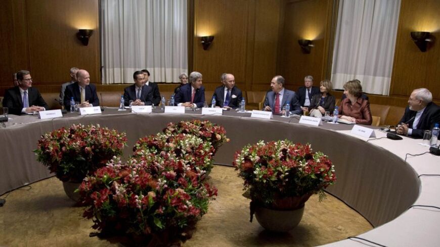 (L-R) Germany's Foreign Minister Guido Westerwelle, British Foreign Secretary William Hague, Chinese Foreign Minister Wang Yi, U.S. Secretary of State John Kerry, French Foreign Minister Laurent Fabius, Russia's Foreign Minister Sergei Lavrov, EU foreign policy chief Catherine Ashton and Iranian Foreign Minister Mohammad Javad Zarif gather at the United Nations Palais in Geneva November 24, 2013. Iran and six world powers reached a breakthrough deal early on Sunday to curb Tehran's nuclear programme in exc