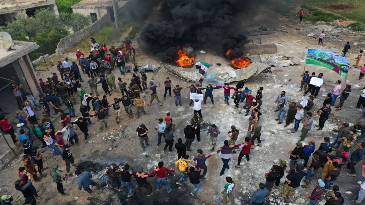 A drone images shows Syrian demonstrators gathering during a protest in the village of Maaret al-Naasan in Syria's Idlib province on May 1, 2020, to protests against a reported attack by Hayat Tahrir al-Sham, an alliance led by a former Al-Qaeda affiliate, on a protest the previous day. (Photo by Omar HAJ KADOUR / AFP) (Photo by OMAR HAJ KADOUR/AFP via Getty Images)