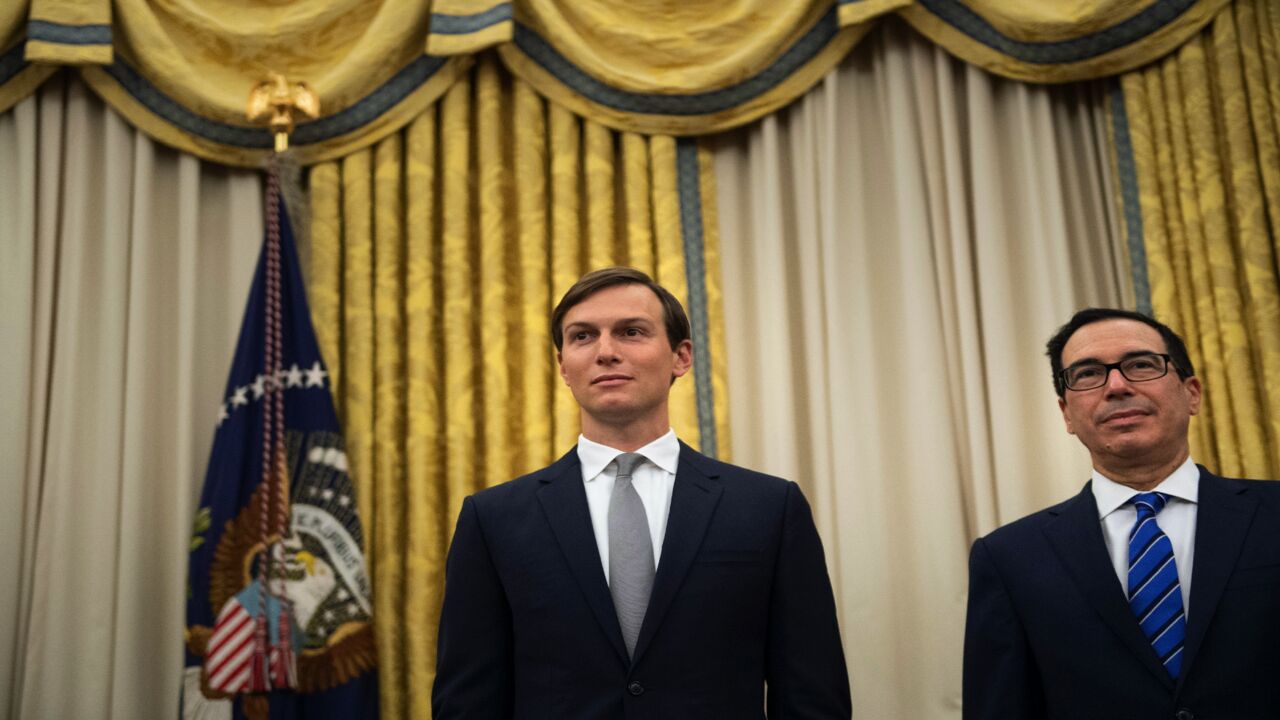 Senior adviser Jared Kushner and US Secretary of the Treasury Steven Mnuchin listen while Donald Trump announces an agreement between the United Arab Emirates and Israel to normalize diplomatic ties, the White House August 13, 2020, in Washington, DC.