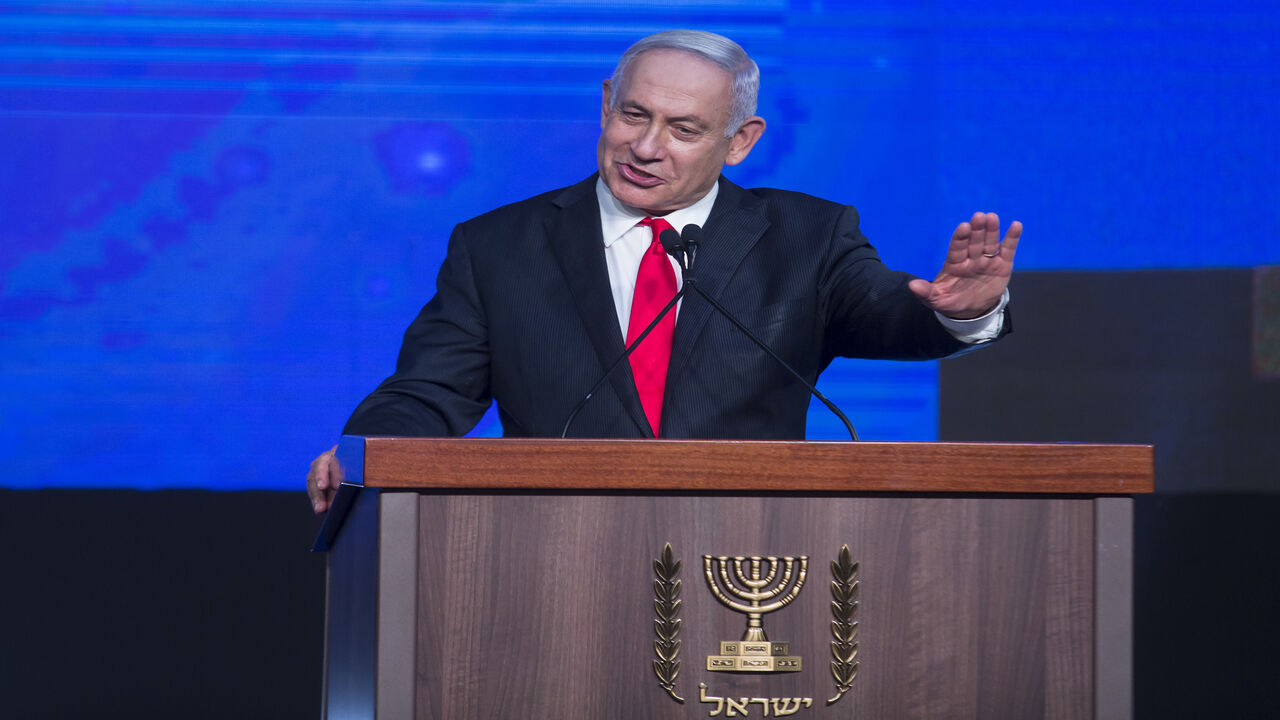 Israeli Prime Minster Benjamin Netanyahu greets supporters as he speaks at the Likud party vote event, Jerusalem, March 24, 2021.