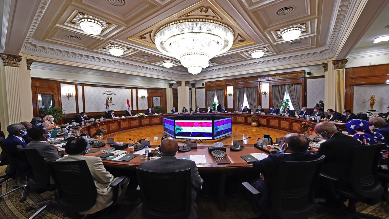 Egyptian Prime Minister Mustafa Madbouly, his Sudanese counterpart, Abdalla Hamdok, and other officials meet in the Egyptian capital, Cairo, on March 11, 2021. Sudan, Egypt and Ethiopia have been locked for almost a decade in inconclusive talks over the filling and operation of the Grand Ethiopian Renaissance Dam (GERD) on the Blue Nile, which broke ground in 2011. 