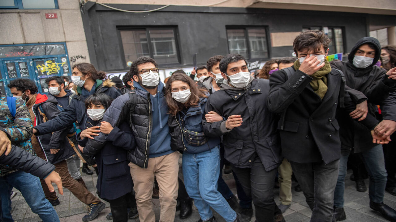 Protesters move away as Turkish police officers intervene during a demonstration in support of Bogazici University students, at Kadikoy in Istanbul, Turkey, April 1, 2021.