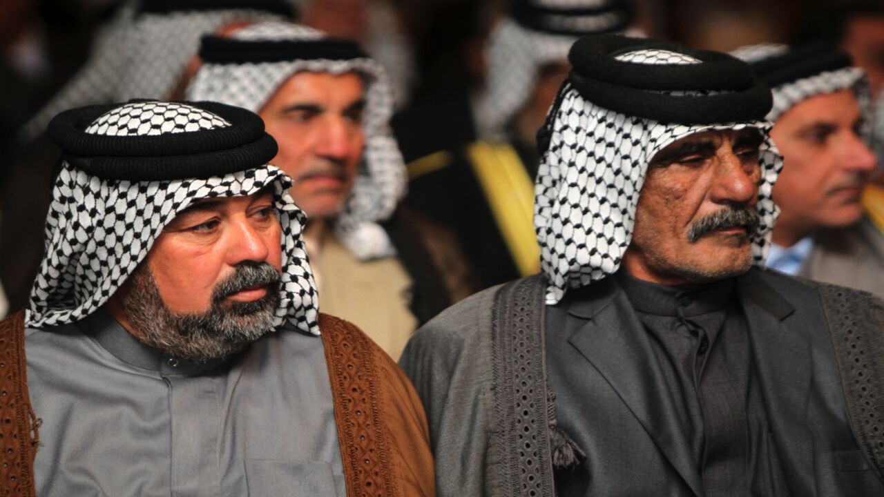 Iraqis attend a conference gathering Shiite and Sunni tribal leaders and clerics on November 8, 2014, in the capital, Baghdad, to discuss support to Sunni tribes in their fight against the Islamist State (IS) in Anbar province, west of Baghdad.