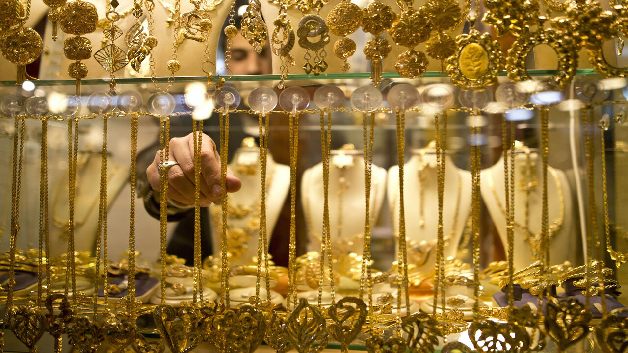 A Palestinian vendor displays a necklace in a window case at a gold market in Gaza City's historic old quarter, Gaza Strip, March 30, 2016.