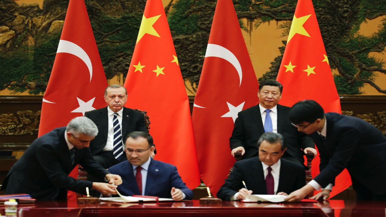 Turkish President Recep Tayyip Erdogan (back-L) and Chinese President Xi Jinping (back-R) attend a signing ceremony ahead of the Belt and Road Forum in Beijing on May 13, 2017.